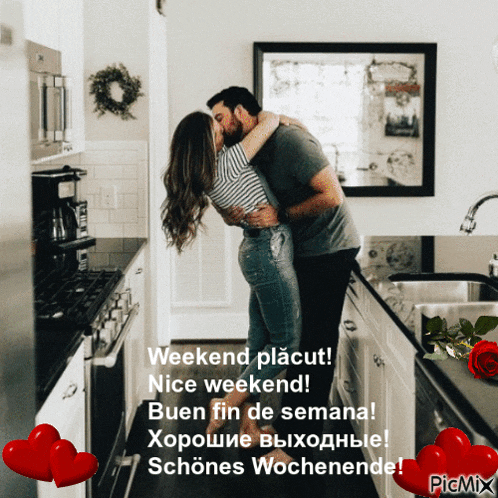 a man and a woman kissing in a kitchen with hearts around them