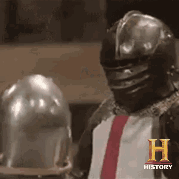 a man wearing a knight 's helmet and a history logo