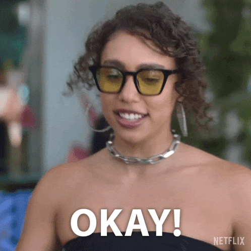 a woman wearing sunglasses and a choker says okay .