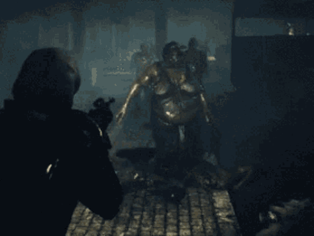 a man holding a gun is standing in front of a zombie