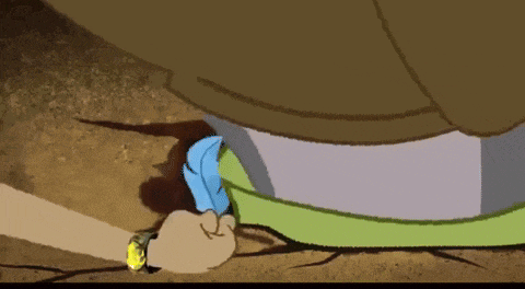 a cartoon of a squirrel laying on the ground next to a yellow and black tape