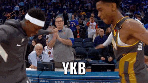 two basketball players are standing next to each other and one of them says ykb