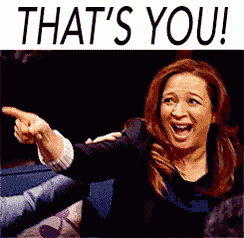 a woman is pointing at something with the words that 's you written above her