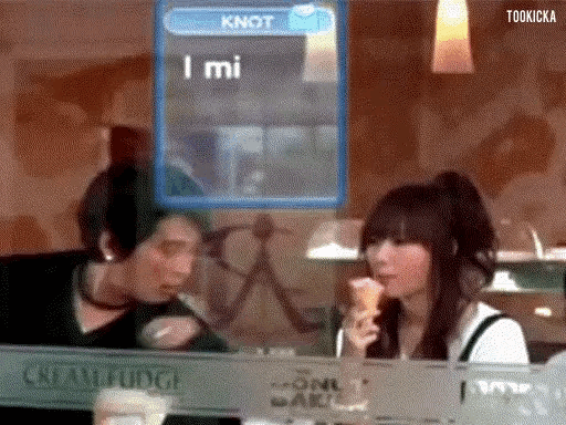 a woman eating an ice cream cone in front of a screen that says knot i mi