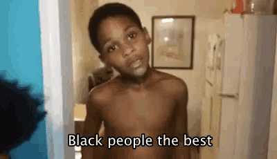 a shirtless young boy is standing in a room with the words `` black people the best '' written on the bottom .