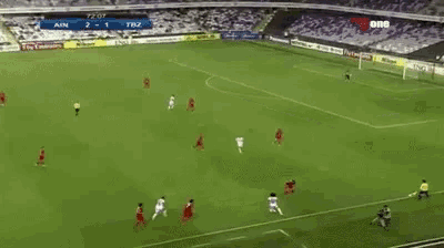 a soccer game is being played in a stadium with ads for fly emirates and ing