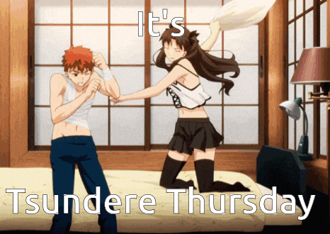 a man and a woman are having a pillow fight and it says it 's tsundere thursday on the bottom