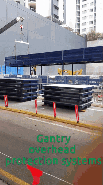 a picture of a construction site with the words gantry overhead protection systems at the top