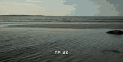 a beach with the word relax in the middle