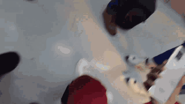 a blurry picture of a person using a tablet computer