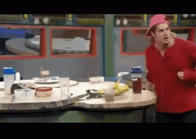 a man in a red shirt and pink hat is running