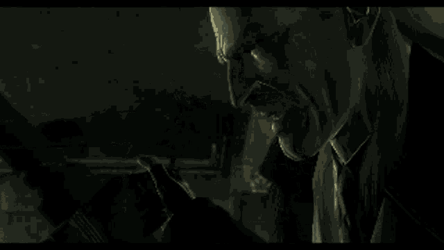a man and a woman are looking at each other in a dark room
