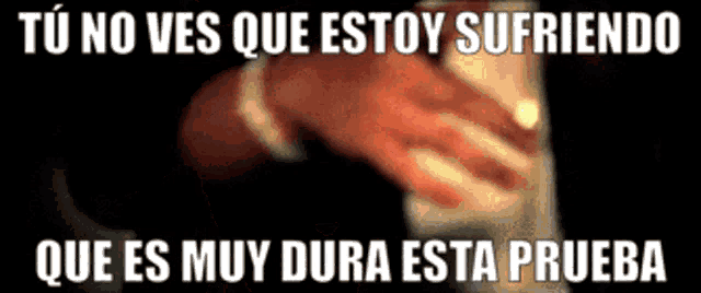a man in a suit is holding something in his hand with the words " tu no ves que estoy sufriendo " written above him