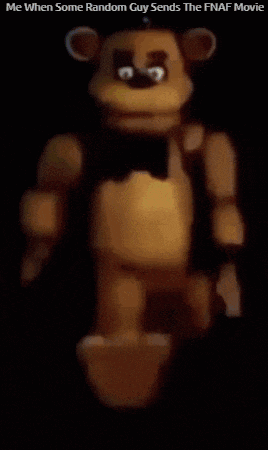 a brown teddy bear is standing in the dark with a black bow tie .