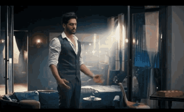 a man in a suit is standing in a room