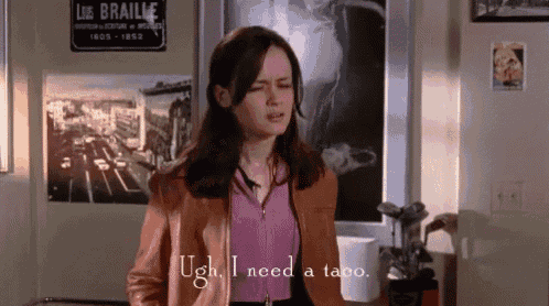 a woman in a brown leather jacket says ugh i need a taco .