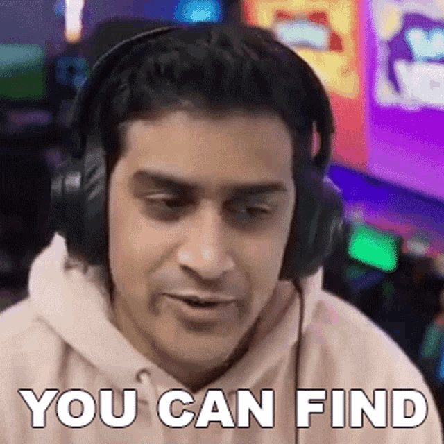 a man wearing headphones is saying `` you can find '' while playing a video game .