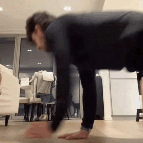 a person is doing push ups on the floor