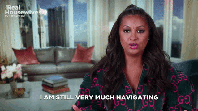 a woman says i am still very much navigating in front of a living room