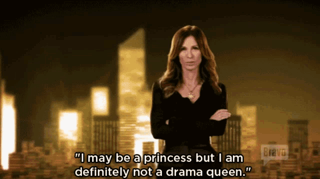 a woman says " i may be a princess but i am definitely not a drama queen " in front of a cityscape