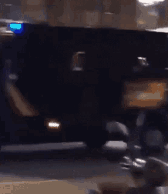 a blurred image of a police car with the letters policia on the back
