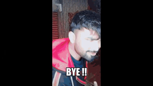 a man with a bandana on his head is saying bye !!