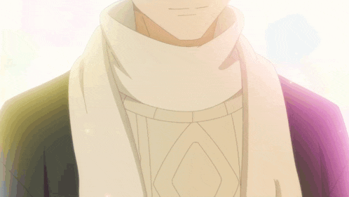 a close up of a person wearing a white scarf