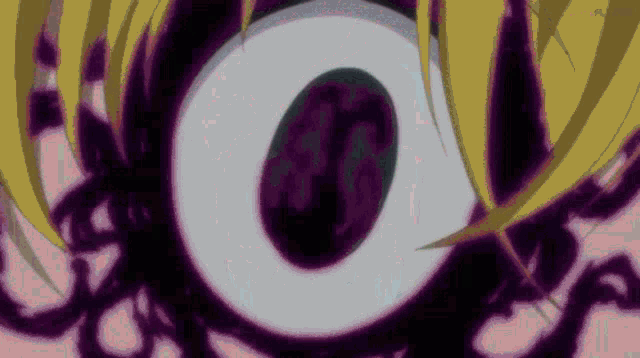 a close up of a person 's eye with a purple center
