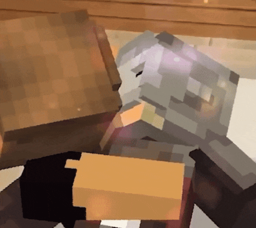 a minecraft character laying on the floor with a box in front of them