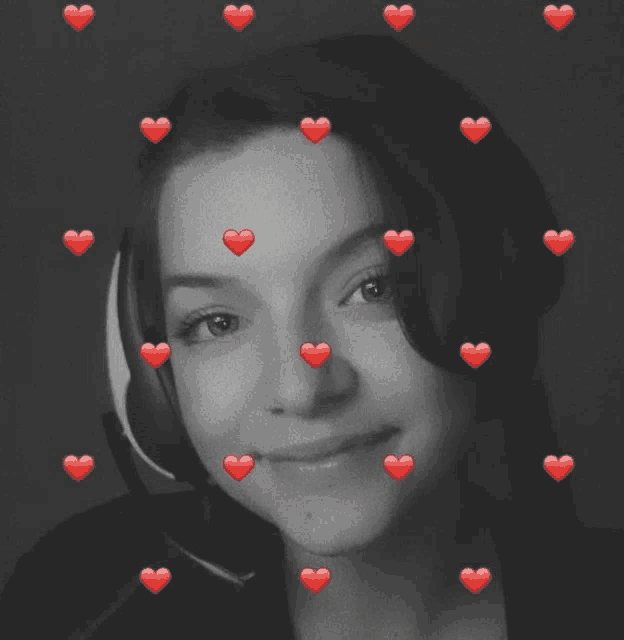 a black and white photo of a girl with hearts around her face