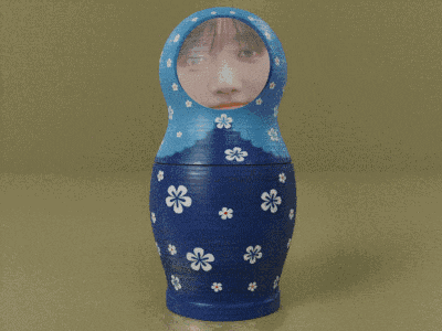a blue green and orange matryoshka doll with flowers on them