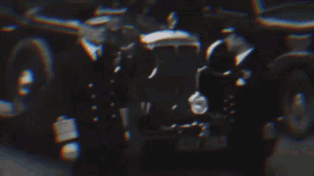 a blurry photo of a group of men with the word army on the bottom right