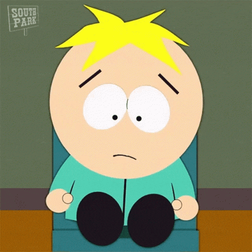 a south park character is sitting in a chair