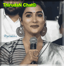 a picture of a woman holding a microphone with the words thiruda n chat written above her