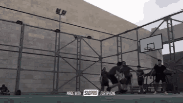 a group of people are playing basketball on a court that is made with slopro for iphone