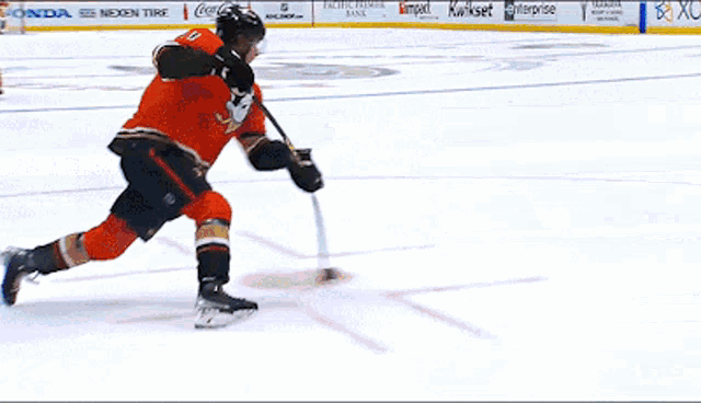 a hockey game is being played in a stadium with a sign that says ' homer ' on it
