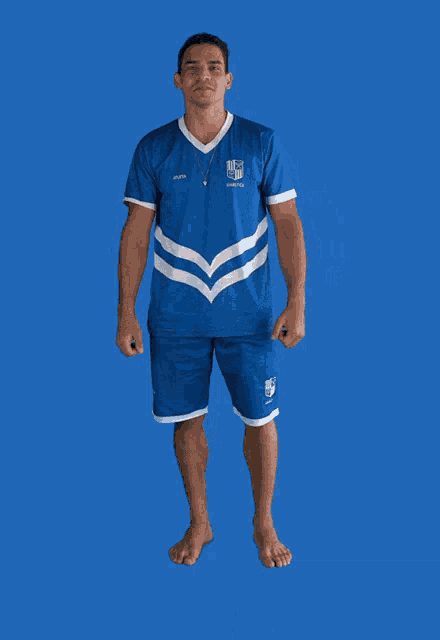 a man wearing a blue shirt and shorts that says ucsd