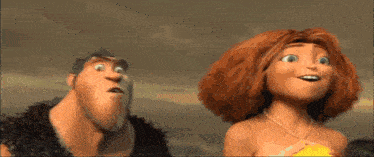 a man and a woman are standing next to each other and the woman is smiling