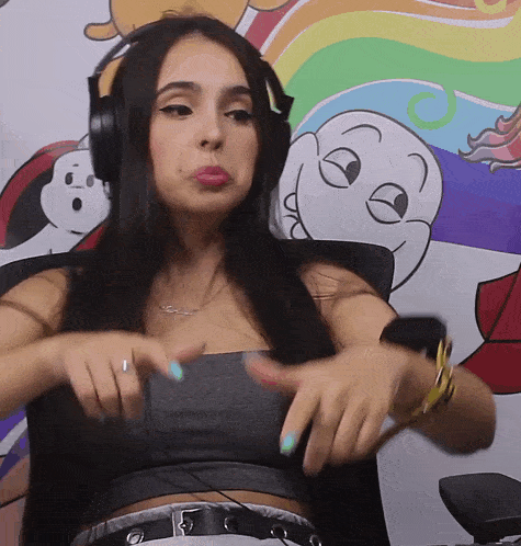 a woman wearing headphones is making a face in front of a cartoon background