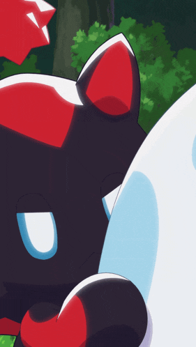 a black cat with red and white ears laying on a white surface