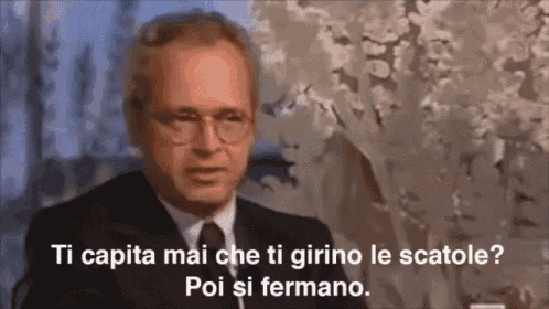 a man in a suit and tie says ti capita mai che ti girino le scatole poi si fermano