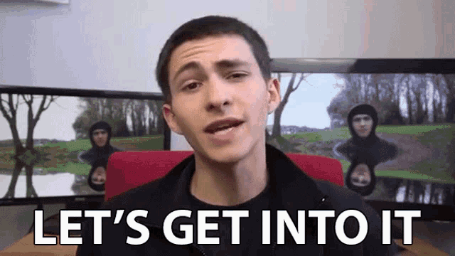 a man says let 's get into it in front of a computer screen