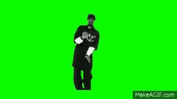 a man in a black shirt and hat is dancing on a green screen .