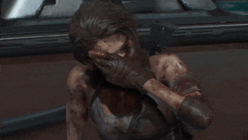 a close up of a woman with blood on her face and arms