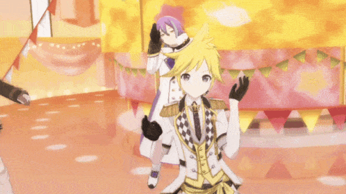 two anime characters are dancing on a stage and one of them is pointing