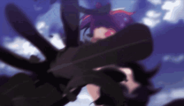 a blurry picture of a person holding a feather in their hand