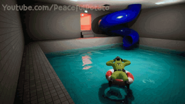 a swimming pool with a blue slide and youtube.com/peacefulpotato written on the bottom