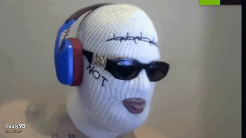 a person wearing headphones and sunglasses with the word not written on their face