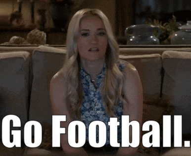 a woman sitting on a couch with the words go football written in white