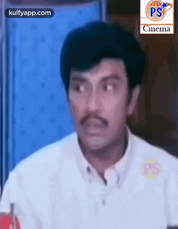 a man with a mustache is wearing a white shirt and a white shirt .